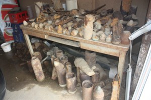 Bomb fragments and unexploded First World War shells sit in a farmer's shed waiting for pickup.